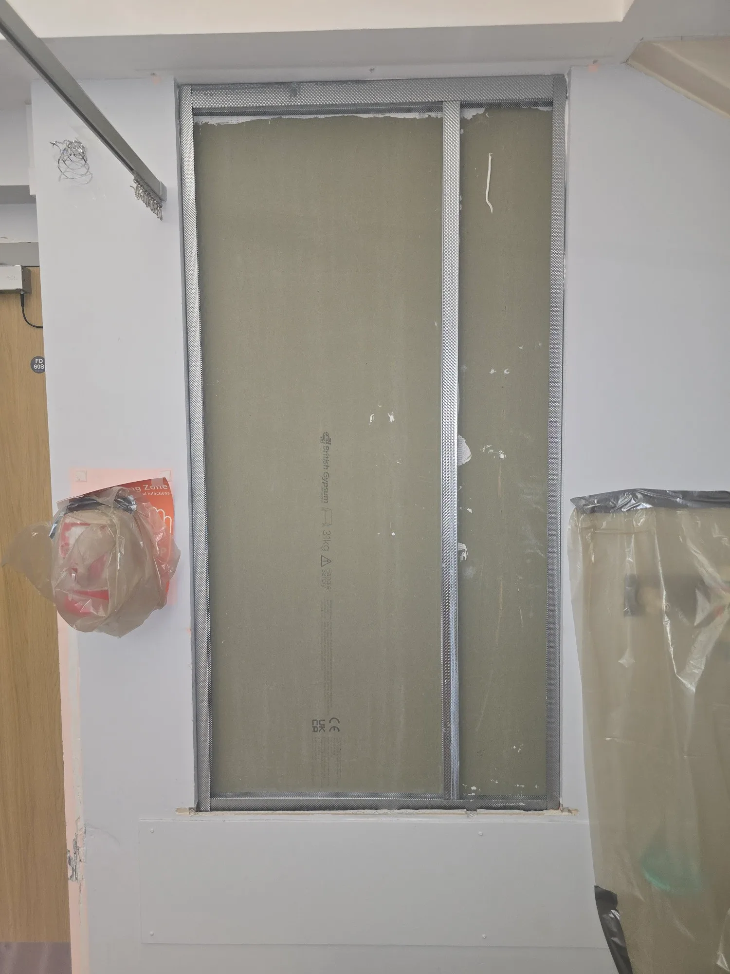 Installation of a fire-rated access panel in a wall for fire protection