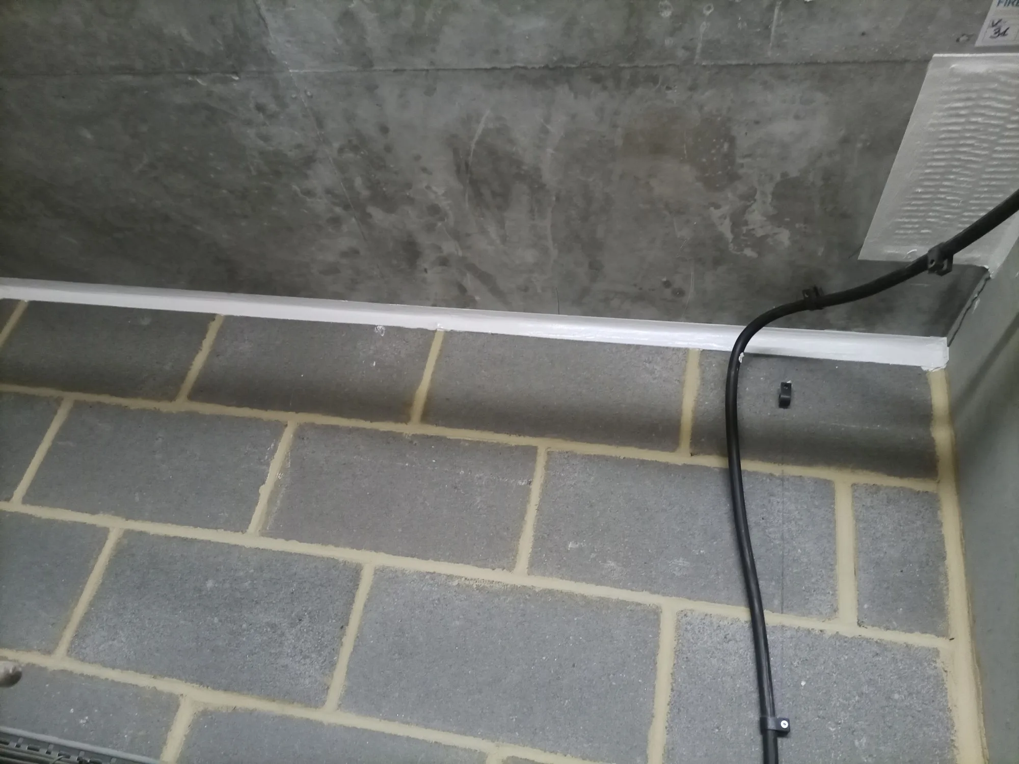 Close-up of a fire stopping application showing a sealed area and visible materials used for fire protection